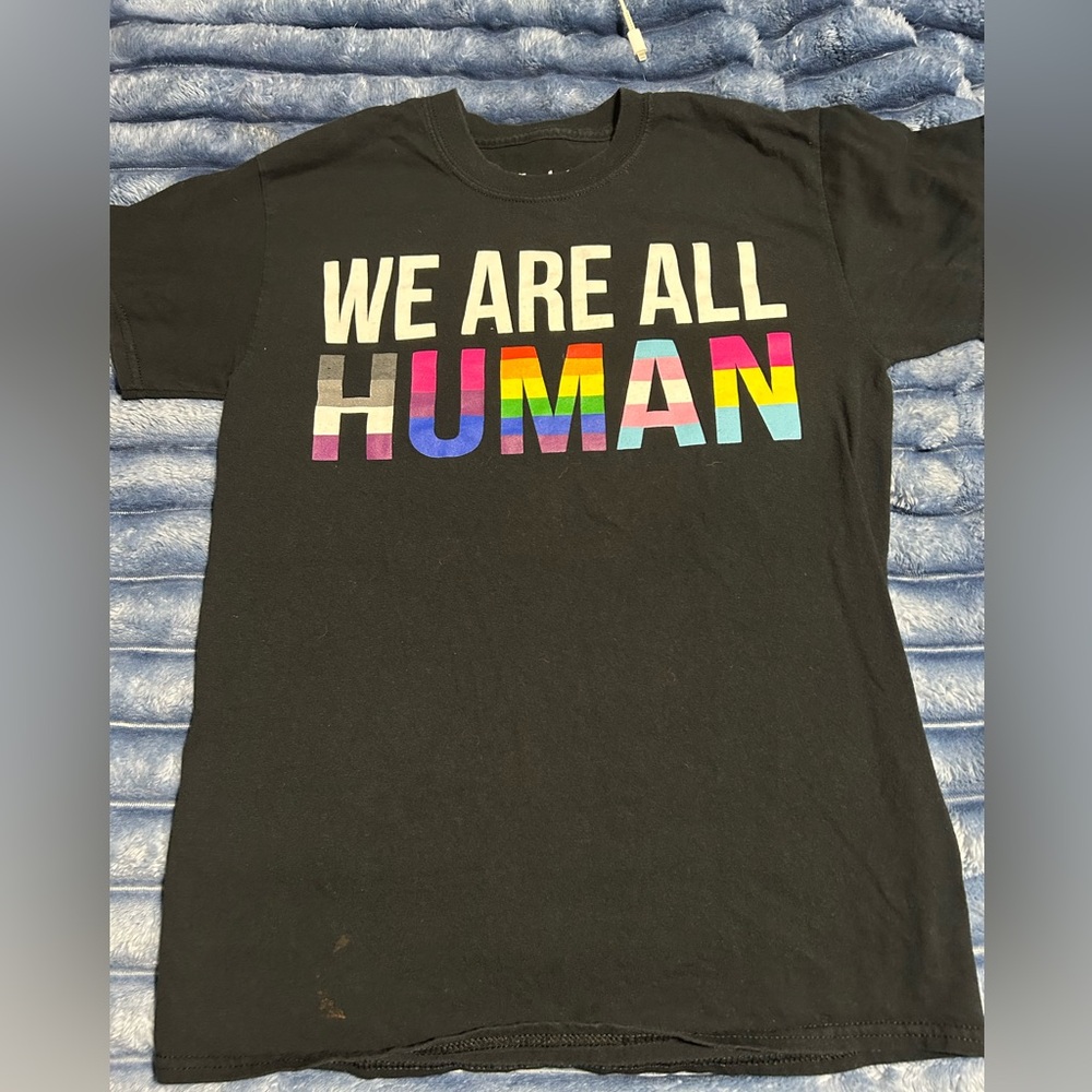 Spencer's Black Tee with multi-color We are All Human.